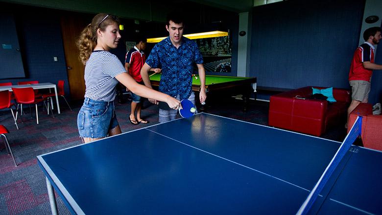 Teenagers playing table tennis
