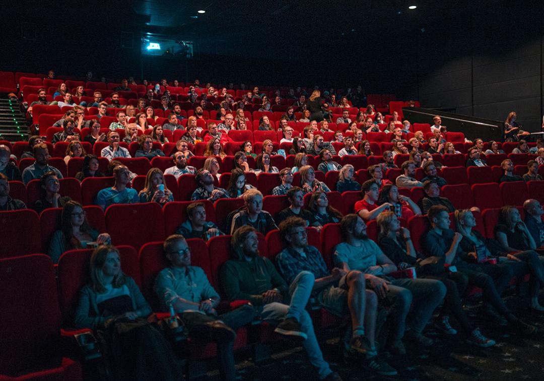 A group of people watching a film.