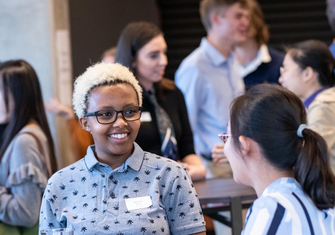 Students chatting at a networking event.