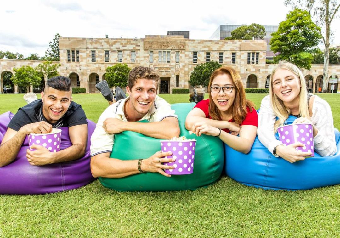 4 students sitting on beanbags in the Great Court