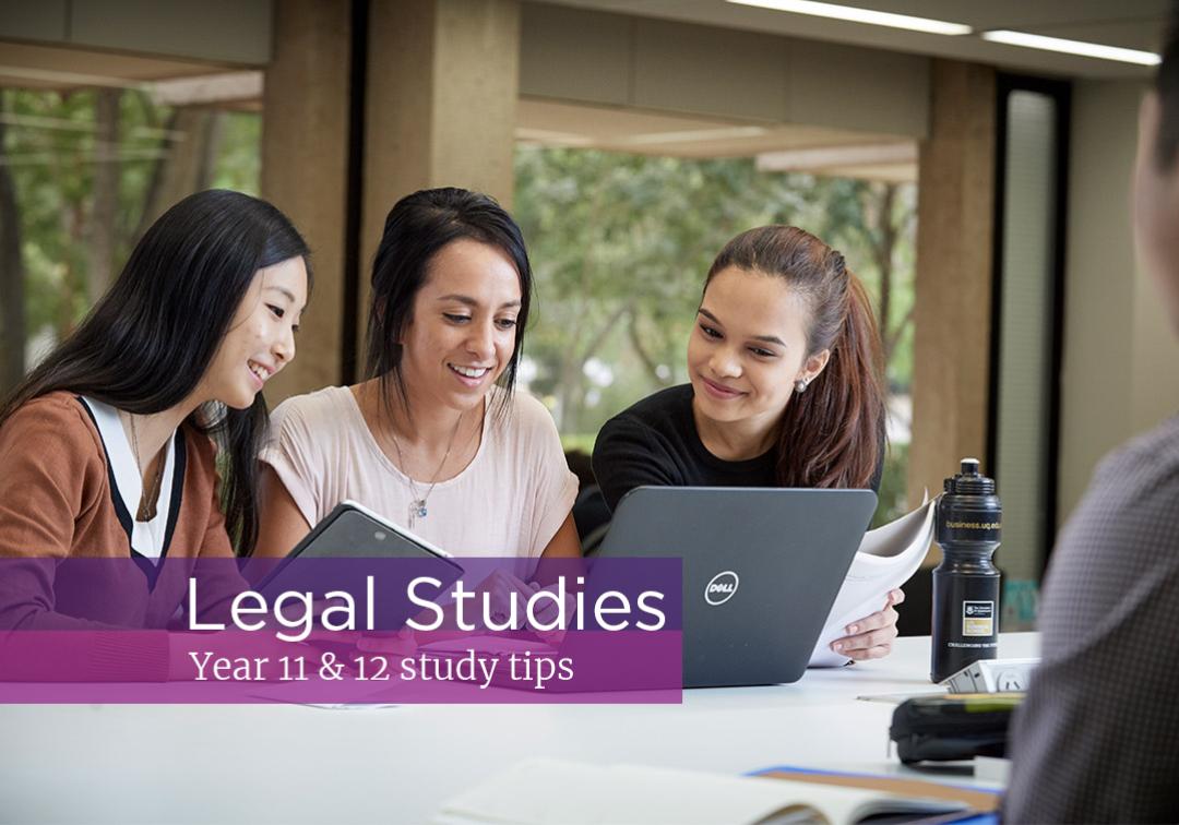 Three friends sit studying Legal Studies with laptop