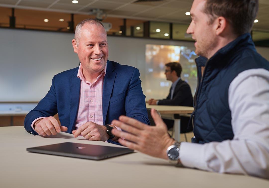 UQ Master of Finance student with teacher Chris Bell