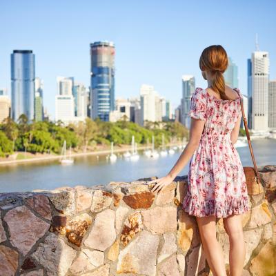 Female student looking at Brisbane's Central Business District from Kangaroo Point.