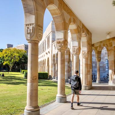 Students walking through the cloisters of UQ's Great Court