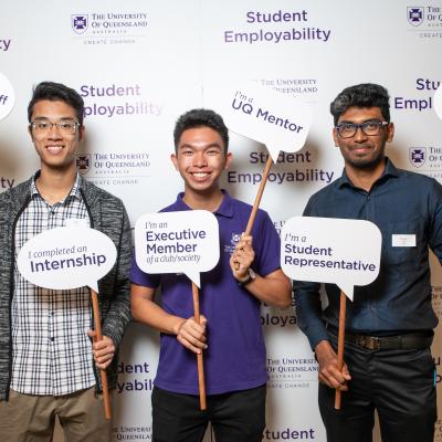 3 students holding employability signs