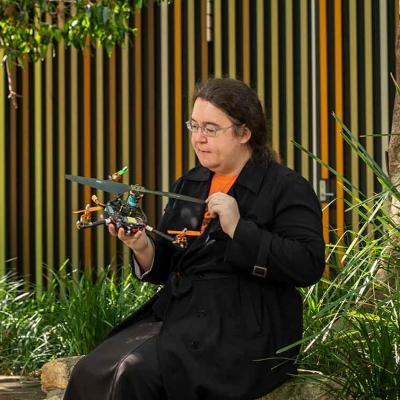 Dr Pauline Pounds holds a quadroter, which looks a little like a drone