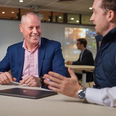 UQ Master of Finance student with teacher Chris Bell