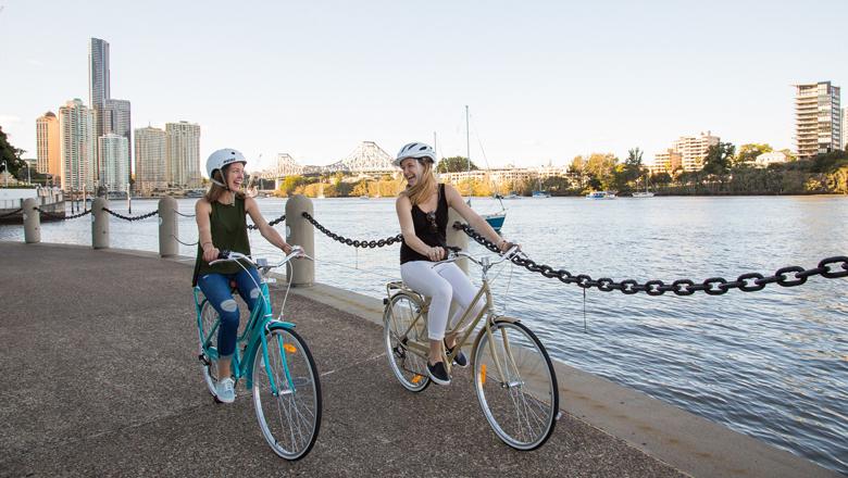 Two friends cycling through Brisbane, Australia