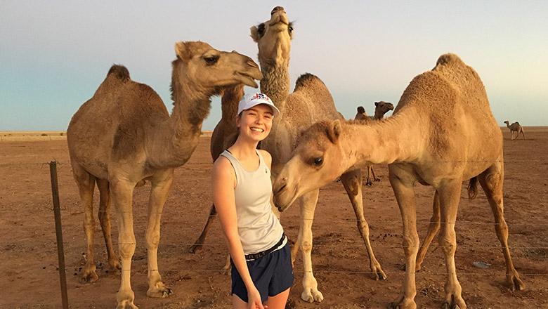 Lisa with camels