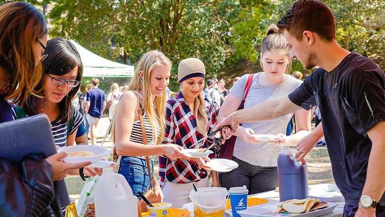 UQ Students are served free pancakes outside on campus