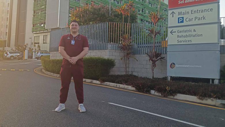 Daniel standing in front of Rockhampton Hospital.