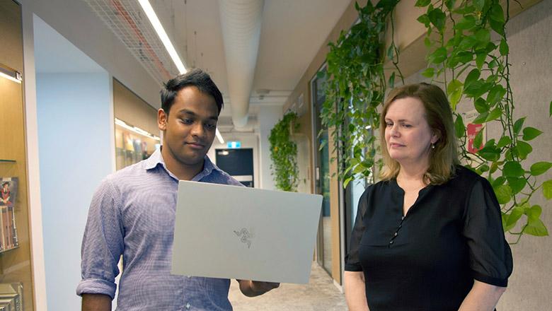 UQ Med student Prabasha Thilakaratne and Associate Professor Margo Lane look at a laptop
