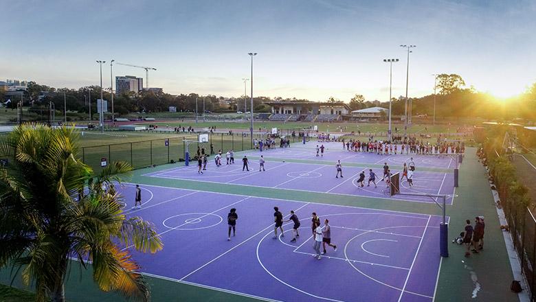 Aerial view of basketball courts at sunset at UQ St Lucia campus