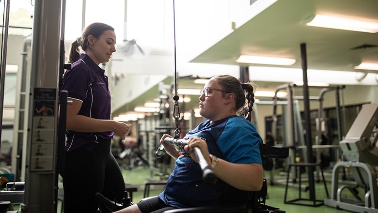 Exercise physiology student in the gym with a client