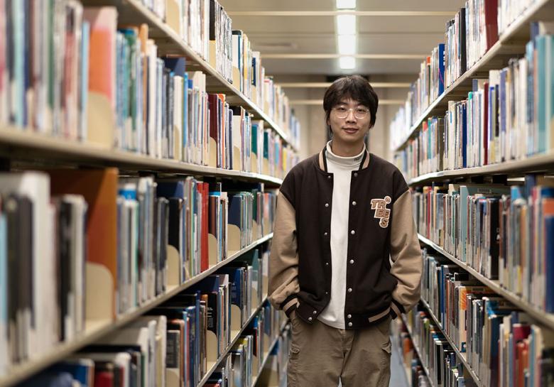 Yutong standing in the library