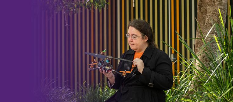 Dr Pauline Pounds holds a quadroter, which looks a little like a drone