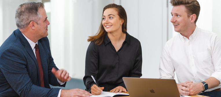 Online vs in person MBA students studying together 