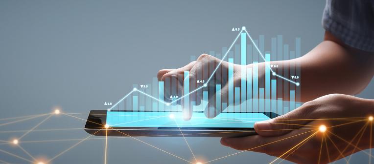 hands holding smart device projecting data