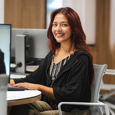 Melanie Seje sitting at a computer