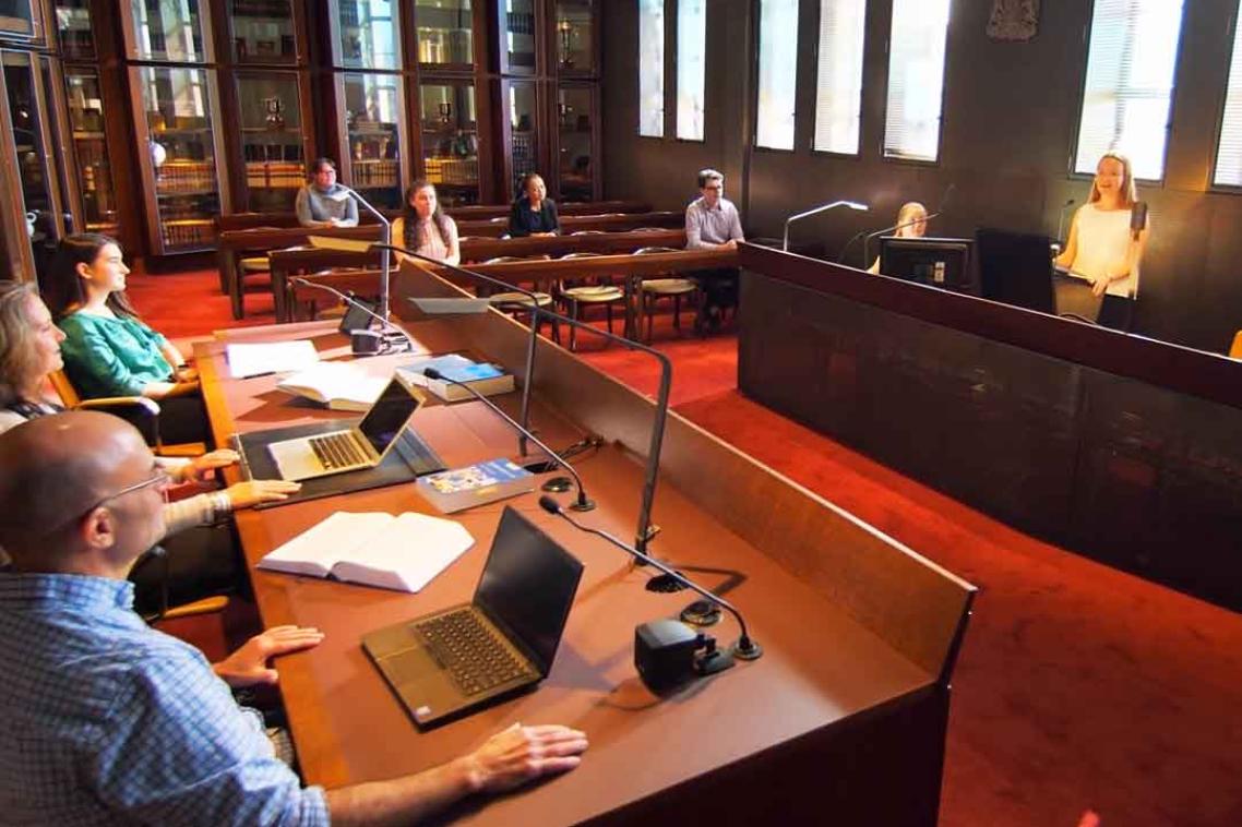 A student participates in a mock trial in the UQ law Moot Court