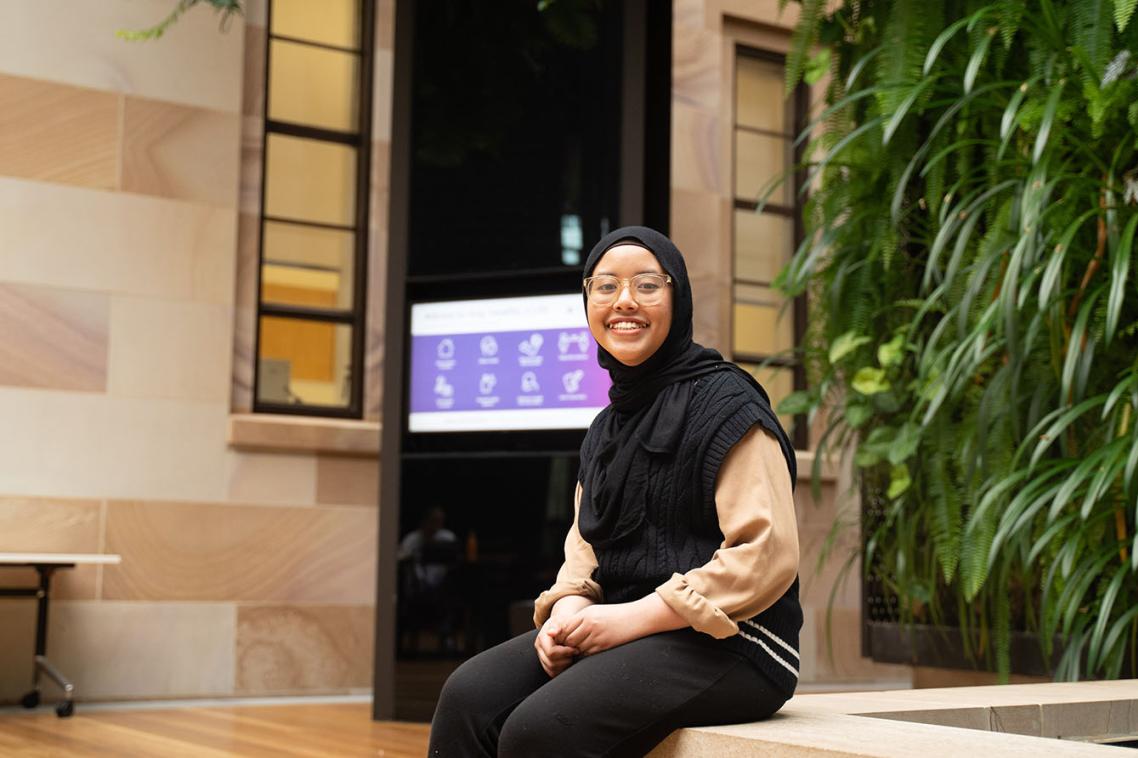 A girl sitting in the Global Change Institute