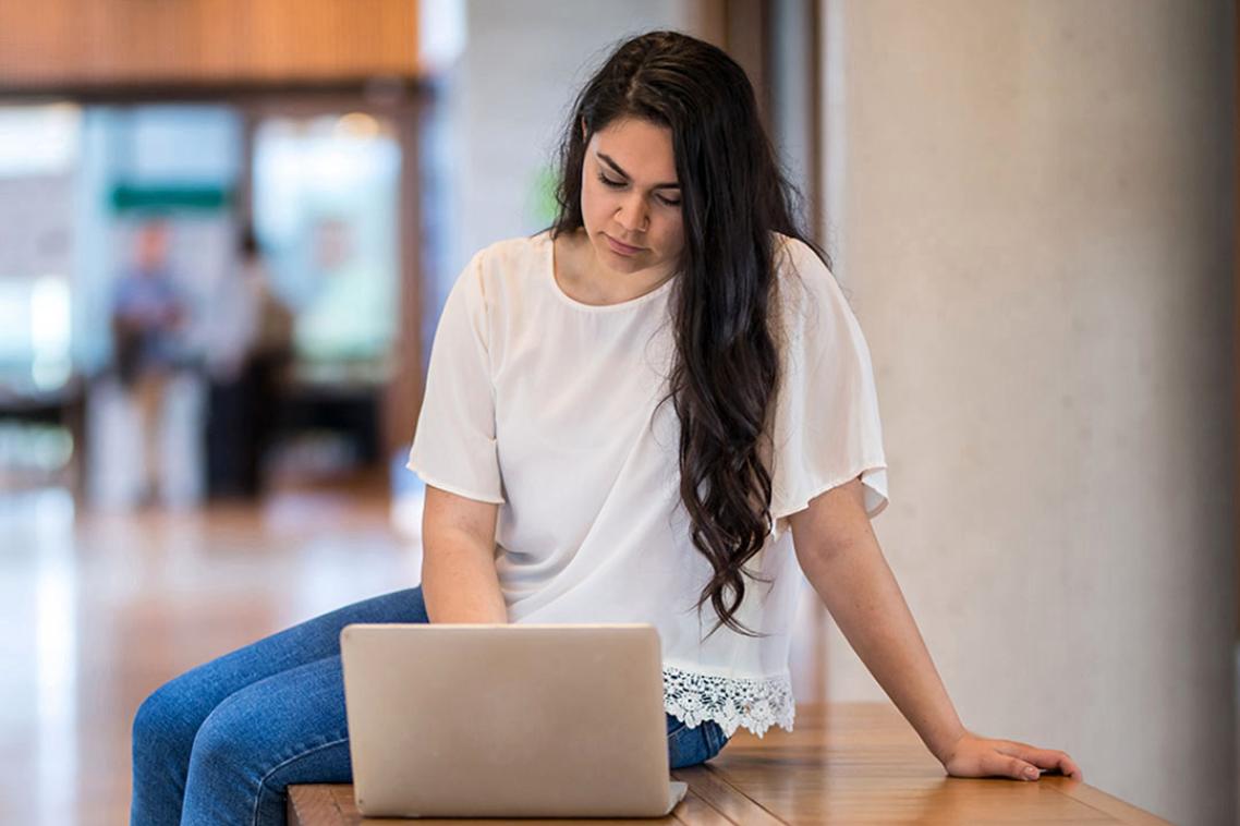 Student staring at laptop