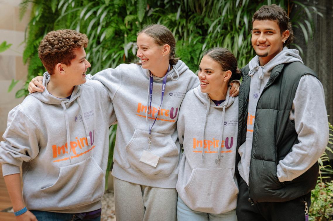 4 students wearing InspireU hoodies 